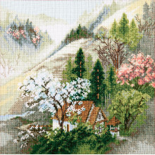 Затишна хатинка у гірського струмка